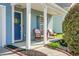 Inviting front porch with seating and view of the manicured landscaping at 328 Bradley Bend Dr, Moncks Corner, SC 29461