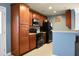 Well-equipped kitchen with wood cabinets and black appliances for modern convenience at 328 Bradley Bend Dr, Moncks Corner, SC 29461