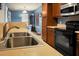 Well-maintained kitchen features a double sink, modern appliances, and hardwood cabinets at 328 Bradley Bend Dr, Moncks Corner, SC 29461