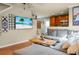 Comfortable living room features a cozy sectional sofa and TV with a beach scene at 328 Bradley Bend Dr, Moncks Corner, SC 29461