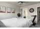 Comfortable main bedroom featuring neutral walls, ceiling fan, artwork, and glimpses of an attached bathroom at 328 Bradley Bend Dr, Moncks Corner, SC 29461