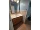 Bathroom vanity with wood cabinets and beige tile backsplash at 3342 Habitat Blvd Blvd, Johns Island, SC 29455