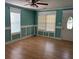 Living room with hard wood floors, windows with blinds, and custom trim at 3342 Habitat Blvd Blvd, Johns Island, SC 29455