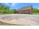 Side view of the house shows the large garage and spacious driveway, offering ample parking at 3936 Lodge Hwy, Smoaks, SC 29481