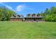 Beautiful country home with a large front lawn and wrap-around porch, perfect for outdoor living at 3936 Lodge Hwy, Smoaks, SC 29481