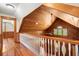 Hallway with wood floors and ceiling featuring a railing overlooking another level at 3936 Lodge Hwy, Smoaks, SC 29481