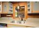 Close up of kitchen sink, granite countertops, window and cabinets at 3936 Lodge Hwy, Smoaks, SC 29481