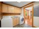 Bright laundry room featuring plenty of cabinets, sink, and washer and dryer at 3936 Lodge Hwy, Smoaks, SC 29481