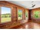 Sun room surrounded with windows with a view of a large backyard at 3936 Lodge Hwy, Smoaks, SC 29481