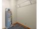 Small utility room with a hot water heater and simple wall-mounted hanging rack at 3936 Lodge Hwy, Smoaks, SC 29481
