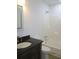 Well-lit bathroom featuring a modern vanity and a shower-tub combo for convenience at 4153 Hickory Ln, Ladson, SC 29456