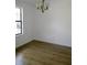 Bright dining room featuring laminate flooring and natural light from a large window at 4153 Hickory Ln, Ladson, SC 29456