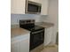 Kitchen featuring stainless steel oven, countertop, and white cabinets at 4153 Hickory Ln, Ladson, SC 29456