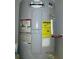 Water heater with caution and energy information labels at 4153 Hickory Ln, Ladson, SC 29456