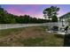 Spacious backyard featuring patio with seating, and a white picket fence bordering the landscape at 427 W Respite Ln, Summerville, SC 29483