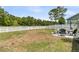 Spacious backyard featuring patio with seating, and a white picket fence bordering the landscape at 427 W Respite Ln, Summerville, SC 29483