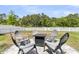 Outdoor fire pit with Adirondack chairs, creating a relaxing ambiance for outdoor gatherings at 427 W Respite Ln, Summerville, SC 29483