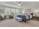 Large bright bedroom with seating area, plantation shutters and ceiling fan at 427 W Respite Ln, Summerville, SC 29483