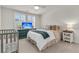 Bright bedroom with plantation shutters, TV, and neutral decor at 427 W Respite Ln, Summerville, SC 29483