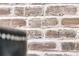 Interior brick wall with white wash, adding a rustic touch to the modern home decor at 427 W Respite Ln, Summerville, SC 29483
