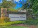 Brick entrance to Limehouse Village featuring lush landscaping and a decorative community sign at 427 W Respite Ln, Summerville, SC 29483