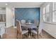Cozy dining room with round table, comfortable seating, and designer wall accent at 427 W Respite Ln, Summerville, SC 29483
