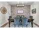 Beautiful dining room with brick accent wall, elegant chandelier, and sophisticated decor for gatherings at 427 W Respite Ln, Summerville, SC 29483