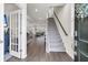 Bright foyer featuring wood floors, staircase, and an open view into the spacious living areas at 427 W Respite Ln, Summerville, SC 29483