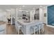Modern kitchen island with seating, stainless steel appliances, and sleek cabinetry at 427 W Respite Ln, Summerville, SC 29483