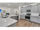 Spacious kitchen featuring stainless steel appliances, white subway tile backsplash, and hardwood floors at 427 W Respite Ln, Summerville, SC 29483