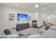 Inviting living room featuring a modern sectional, TV, and decorative shelving at 427 W Respite Ln, Summerville, SC 29483