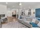 Open-concept living room showcasing a seamless flow to the dining area and kitchen at 427 W Respite Ln, Summerville, SC 29483