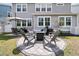Backyard patio features an outdoor fire pit and conversation set, creating a cozy area for relaxation at 427 W Respite Ln, Summerville, SC 29483