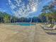 Large community pool with lounge chairs ready for relaxation under the summer sun at 427 W Respite Ln, Summerville, SC 29483