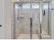 Glass enclosed tiled shower stall with window and built-in bench at 427 W Respite Ln, Summerville, SC 29483