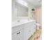 Bright bathroom features a double sink vanity, white cabinets, and a shower-tub combination, designed for comfort at 4709 Marlboro Pl, North Charleston, SC 29405