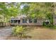 Charming home with neat landscaping, showcasing a welcoming front exterior and curb appeal at 4709 Marlboro Pl, North Charleston, SC 29405