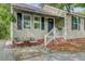 Charming front porch with seating area, enhancing curb appeal and providing a welcoming entrance at 4709 Marlboro Pl, North Charleston, SC 29405