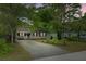 Charming single-story house with a long driveway and front yard, perfect for suburban living at 4709 Marlboro Pl, North Charleston, SC 29405
