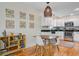 Bright kitchen with white cabinets, stainless steel appliances, and adjacent dining area at 4709 Marlboro Pl, North Charleston, SC 29405