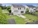 Aerial shot of fenced backyard with green lawn and a small patio area at 4747 Lewis And Clark Trl, Summerville, SC 29485