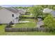 Backyard features a well-maintained lawn, storage shed, and privacy fence at 4747 Lewis And Clark Trl, Summerville, SC 29485