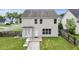 Back exterior view with a door, patio, and a partially fenced yard at 4747 Lewis And Clark Trl, Summerville, SC 29485
