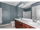 Bathroom features a double sink vanity, updated fixtures and tile flooring at 4747 Lewis And Clark Trl, Summerville, SC 29485