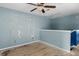 A view of a spacious bedroom featuring a ceiling fan and partial wall with stairs at 4747 Lewis And Clark Trl, Summerville, SC 29485