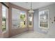 Bright breakfast nook with large windows offering outdoor views and neutral tile floors at 4747 Lewis And Clark Trl, Summerville, SC 29485