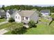 Two-story home with light siding, a blue front door, and a well-maintained lawn and landscaping at 4747 Lewis And Clark Trl, Summerville, SC 29485