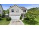 Two-story home with light siding, a two-car garage and a driveway at 4747 Lewis And Clark Trl, Summerville, SC 29485