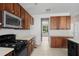Kitchen with wooden cabinetry and appliances, perfect for renovation at 4747 Lewis And Clark Trl, Summerville, SC 29485