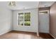 Living room with unfinished floors featuring a large window overlooking the front yard at 4747 Lewis And Clark Trl, Summerville, SC 29485